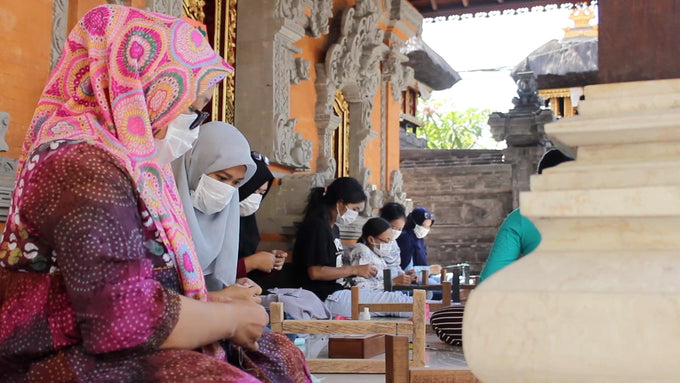 women making bracelets in bali